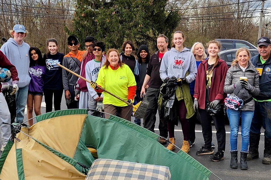 Group of people working behind a tent